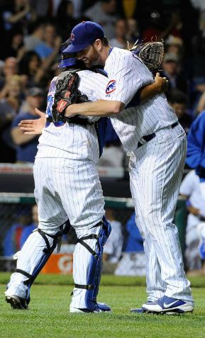 xxxxx hugs Dioner xxx after his first complete-game win (MLB.com)