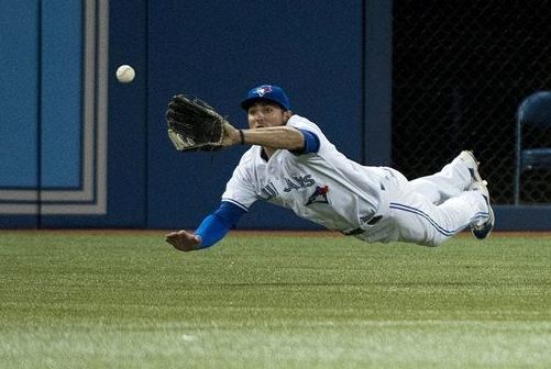 Kevin Pillar makes diving catch of a ball hit by Boston Red Sox' Jonny Gomes during the sixth inning on 8/14/2013 (AP Photo/The Canadian Press, Nathan Denette)