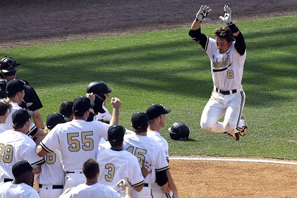 Rhett Wiseman celebrates after hitting a walk-off home run for Vanderbilt in 2015